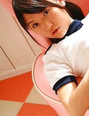 Noriko Kijima in sports equipment is playful in the house