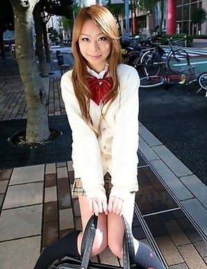 Remika Uehara poses on the street