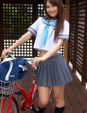 Misaki Nito in school uniform goes to classes riding bike