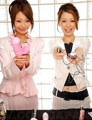Yuri and Yu posing with sex toys