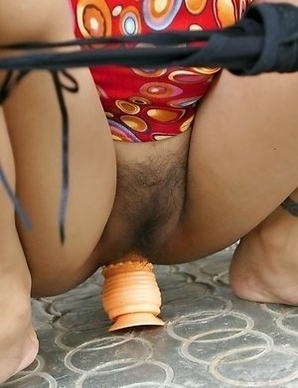 April Lim Stuffs Her Pussy With Big ToyApril Lin is posing next to the three. She looks amazing in her red shirt and she just loves touching her breas