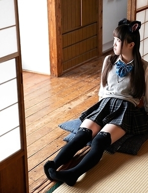 Sexy Japanese girl dressed as a schoolgirl masturbates alone