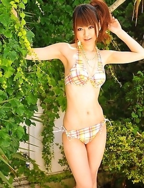 Asian girls pose in bikinis outside