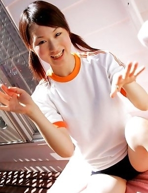 Naoko Sawano in sports outfit plays with balls in garden