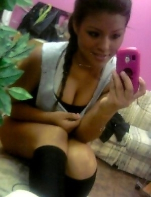 Busty chick infront of the mirror