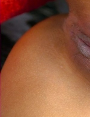 Amara Bhunawat kicks up her leg with her yellow socks and she licks the top of her shoulder. Amara is so kinky that she will make your very horny.