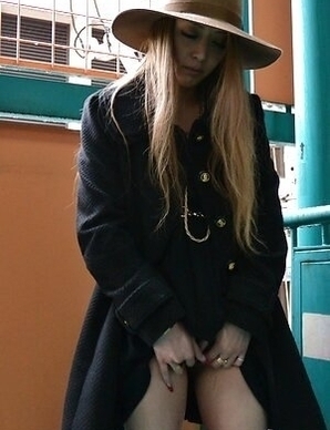 Yui Nagahara with long, blonde hair sucks cocks and rubs her pussy.