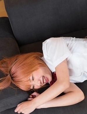 Chie Kobayashi laying on a beautiful bed while brazenly showing her legs/feet